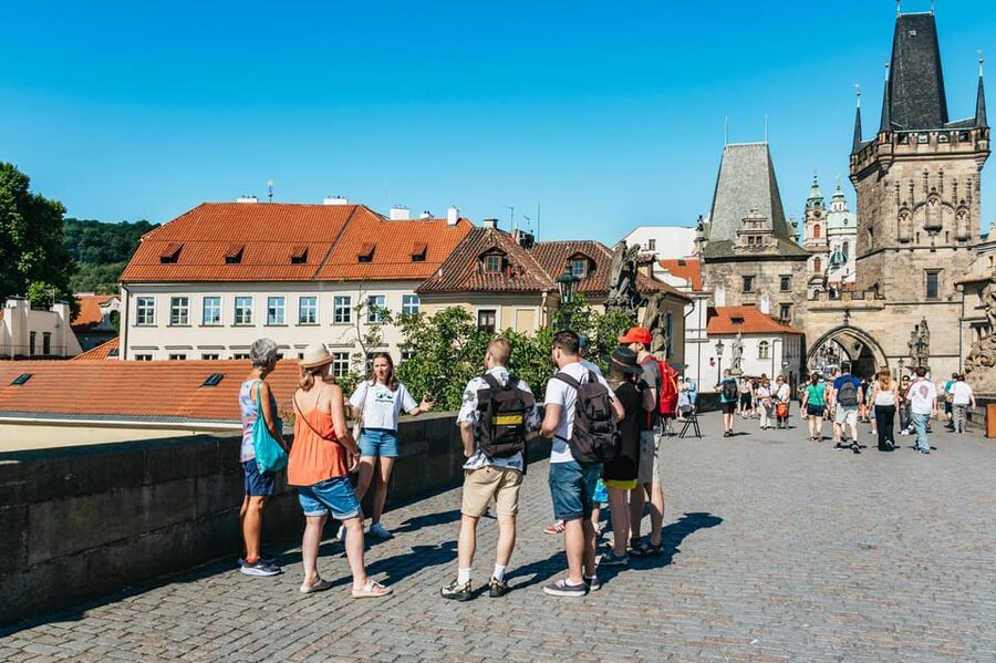 Prague: Old Town, Astronomical Clock and Underground Tour - Crossing Charles Bridge with a story attached